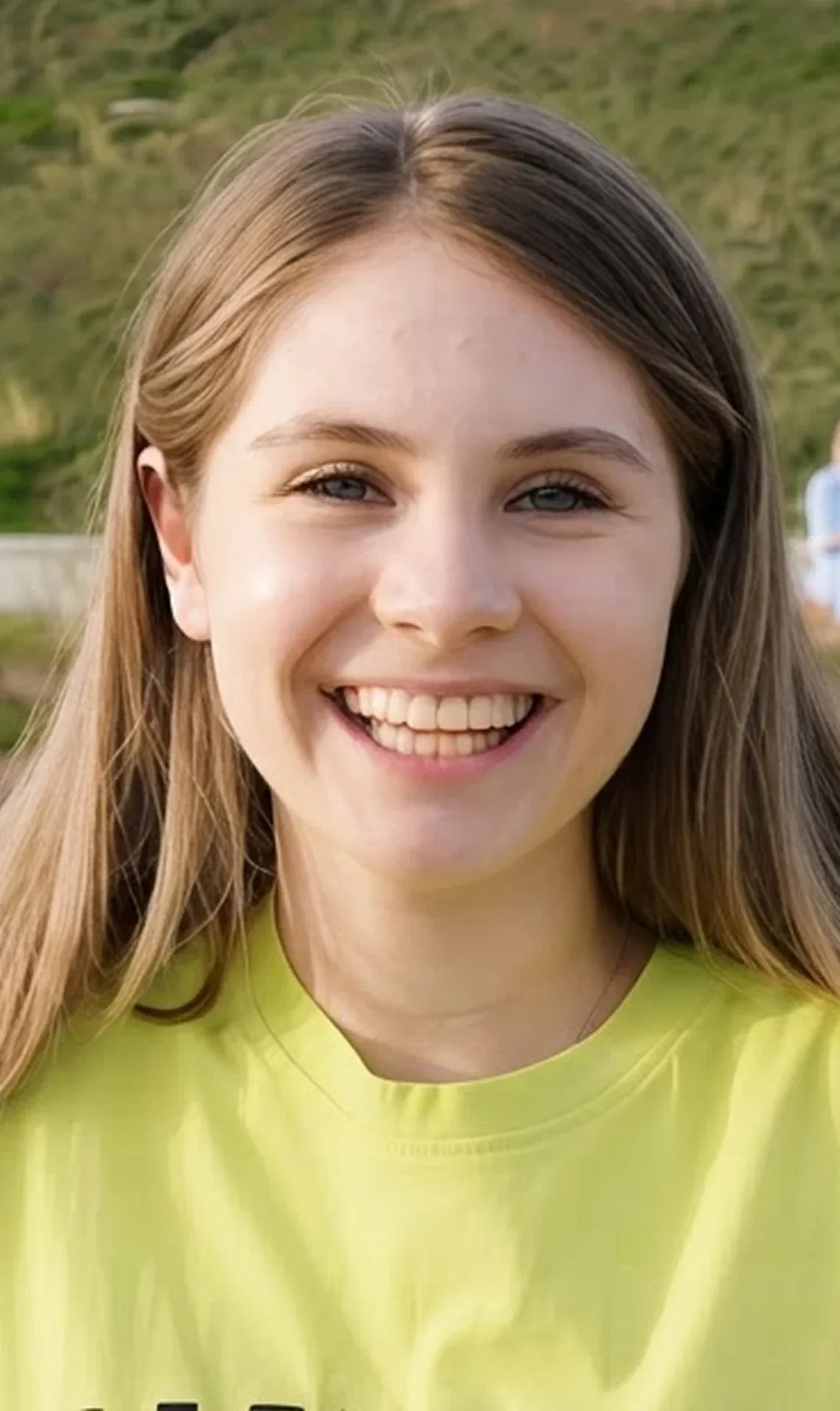 A young customer smiling outdoors